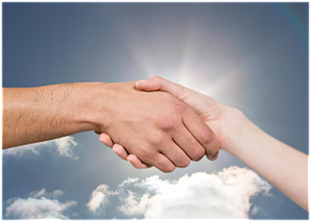 Two hands shaking against a bright sky backdrop with sunlight peeking through clouds.