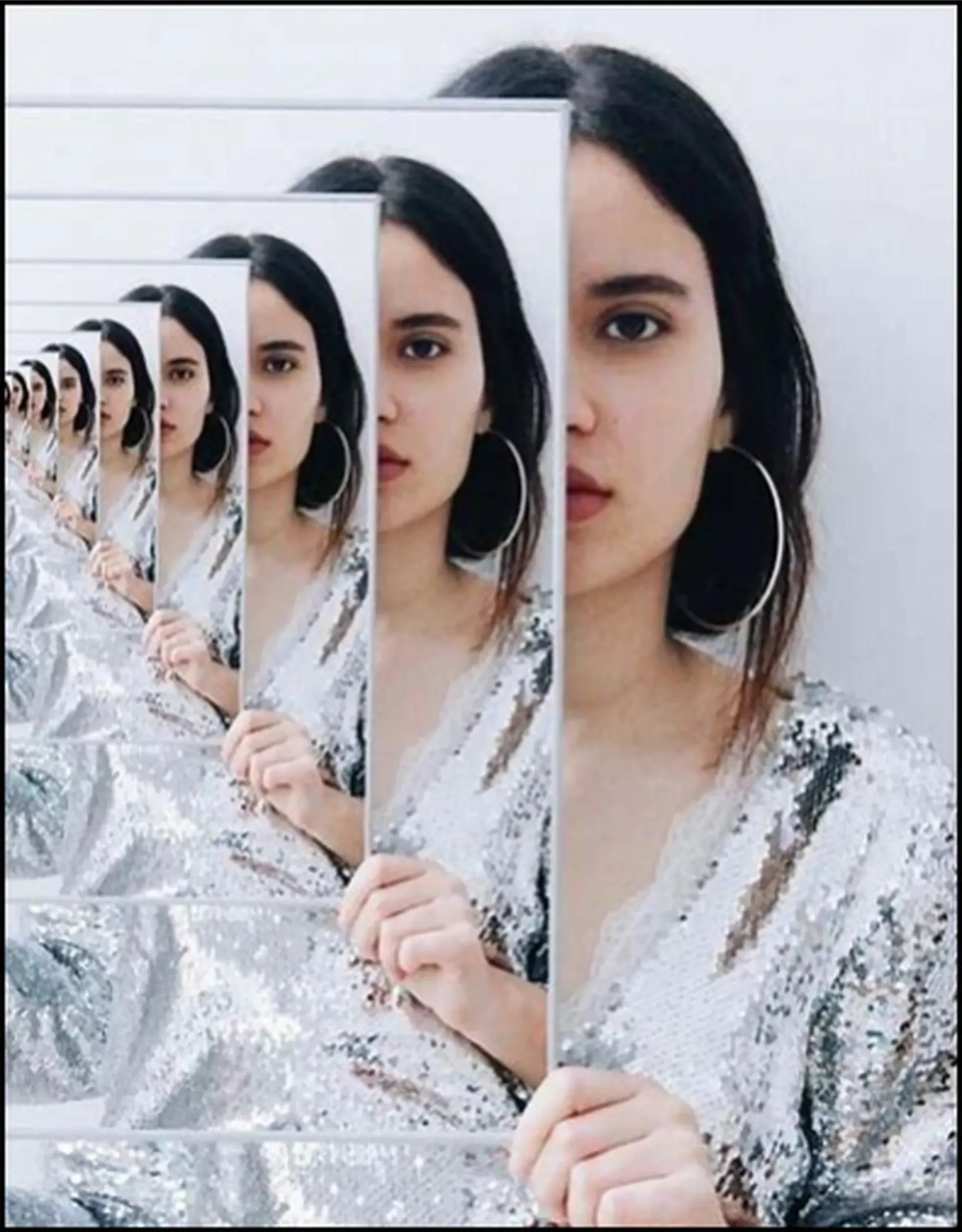 “Woman reflected in multiple mirrors — symbolizing limiting emotional DNA and inherited patterns passed down through generations.”